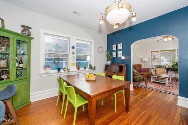 dining space featuring hardwood / wood-style floors and ceiling fan