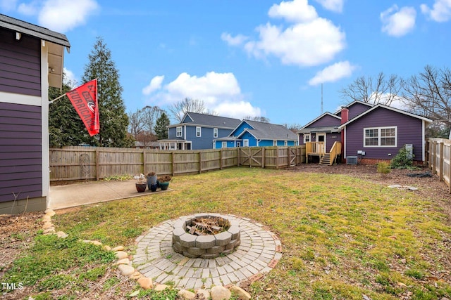 view of yard featuring a patio and a fire pit