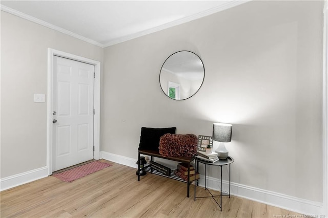 entrance foyer with crown molding and light wood-type flooring