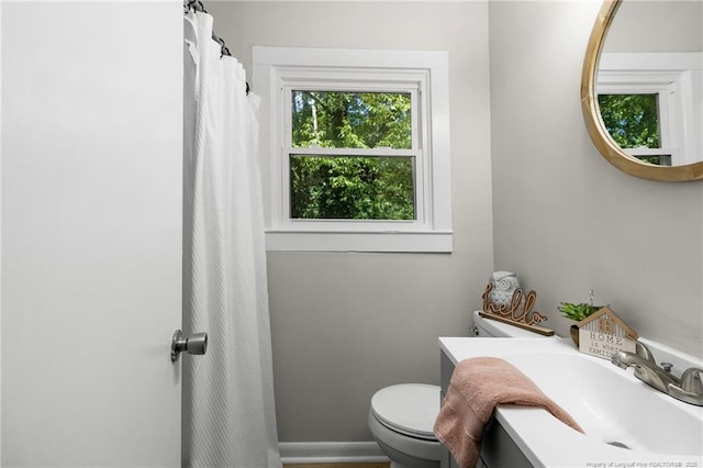 bathroom featuring sink and toilet