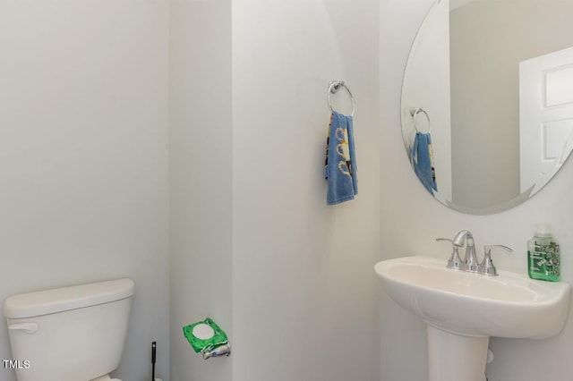 bathroom with sink and toilet