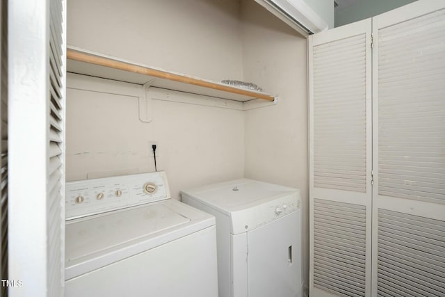 washroom with separate washer and dryer