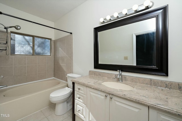 full bathroom with vanity, toilet, tiled shower / bath, and tile patterned flooring