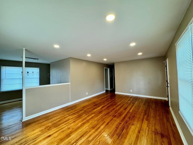 spare room with wood-type flooring