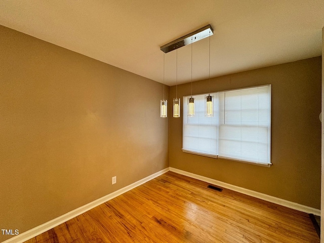 unfurnished dining area with hardwood / wood-style floors