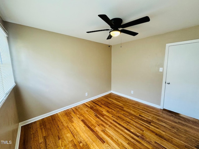 unfurnished room featuring ceiling fan and wood-type flooring