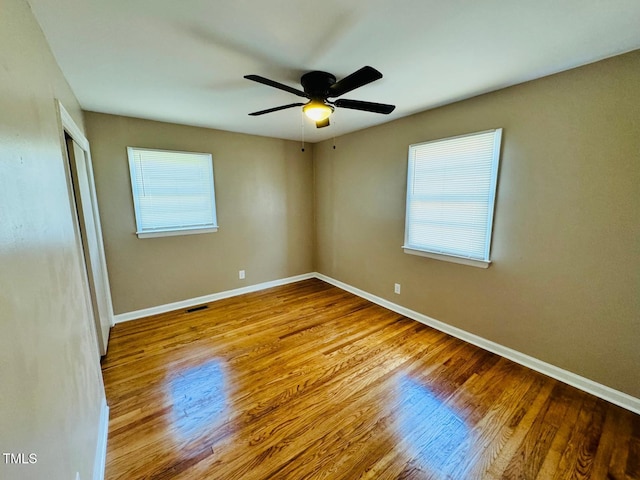 unfurnished room featuring light hardwood / wood-style floors and ceiling fan