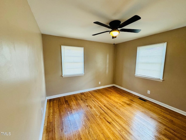 unfurnished room featuring light hardwood / wood-style floors and ceiling fan