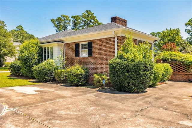 view of side of property with a patio area