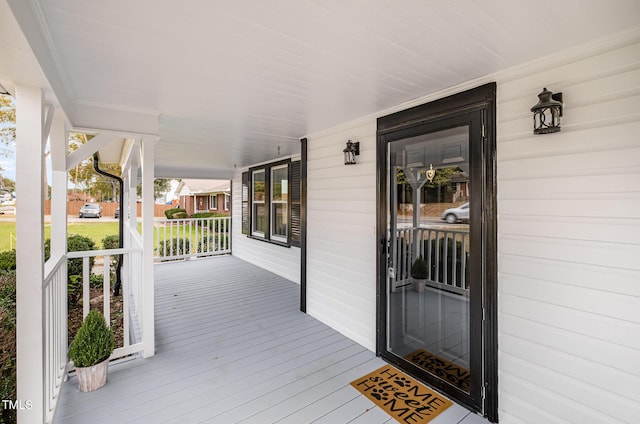 wooden deck featuring covered porch