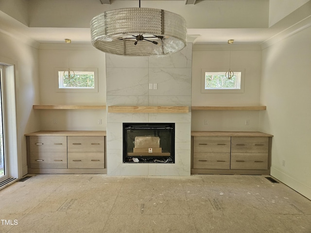 109 Evander Way, Pittsboro, NC 27312 - unfurnished living room with healthy amount of natural light, a premium fireplace, and ceiling fan