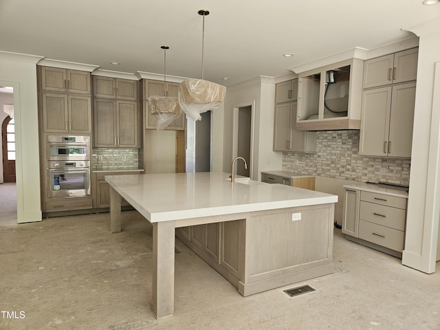 109 Evander Way, Pittsboro, NC 27312 - kitchen with backsplash, double oven, a large island with sink, ornamental molding, and decorative light fixtures