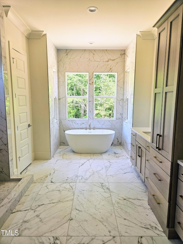 109 Evander Way, Pittsboro, NC 27312 - bathroom with vanity, a freestanding bath, and marble finish floors