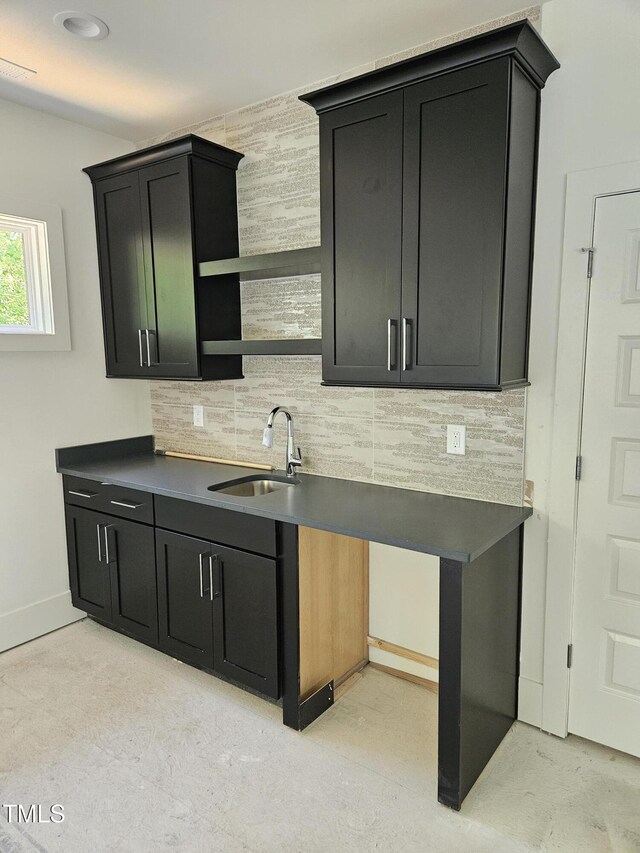 109 Evander Way, Pittsboro, NC 27312 - kitchen with open shelves, decorative backsplash, dark countertops, and dark cabinets