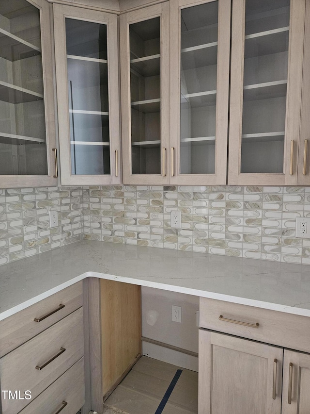 109 Evander Way, Pittsboro, NC 27312 - kitchen with decorative backsplash, glass insert cabinets, and light brown cabinetry