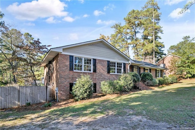 view of front of home with a front lawn