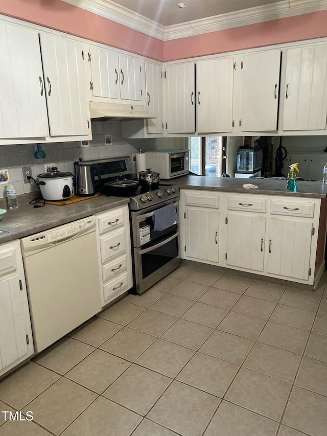 kitchen featuring appliances with stainless steel finishes, tasteful backsplash, white cabinets, ornamental molding, and light tile patterned floors