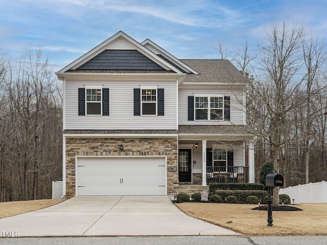 craftsman-style house featuring a garage and covered porch