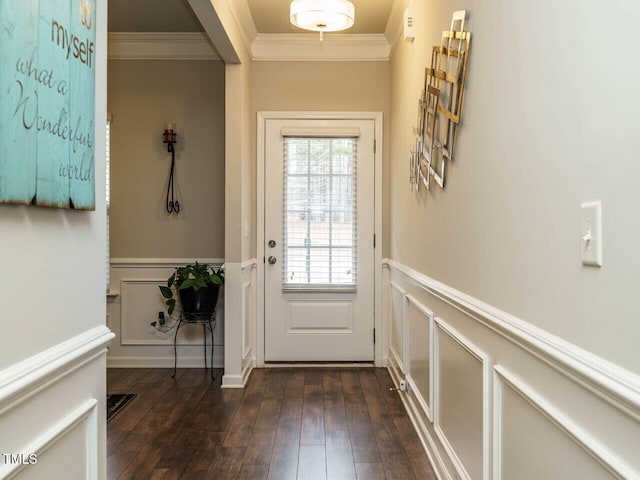 entryway with ornamental molding and dark hardwood / wood-style floors