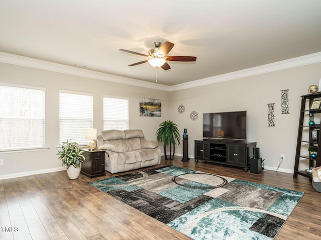 living room featuring ceiling fan, dark wood-type flooring, and ornamental molding