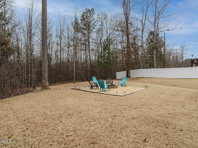 view of yard featuring an outdoor fire pit