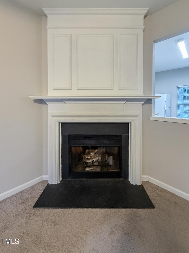 room details featuring white refrigerator and carpet