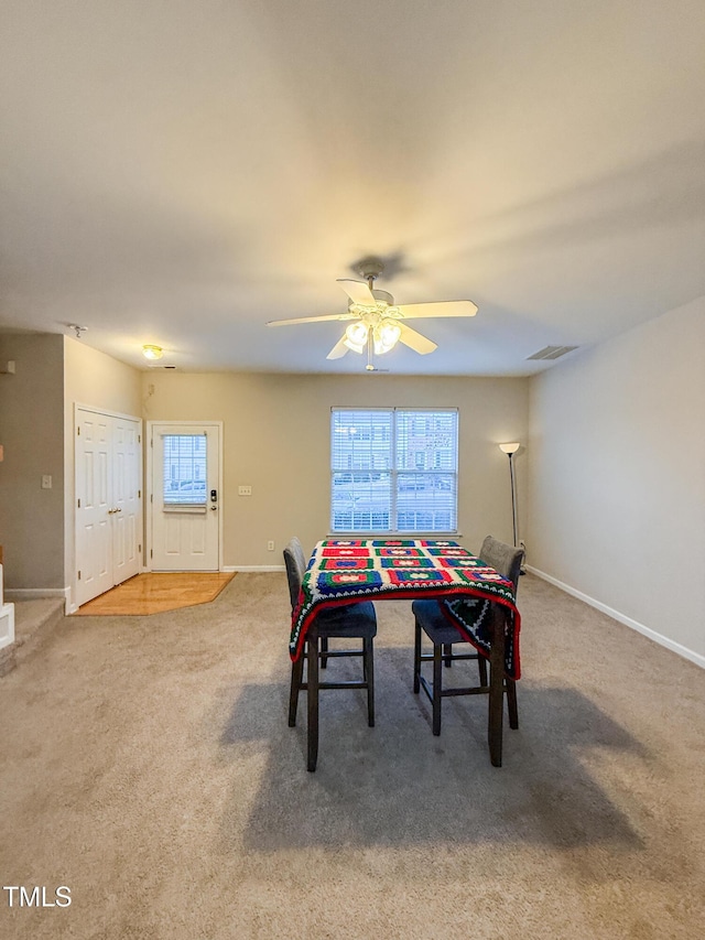 dining room with carpet floors and ceiling fan