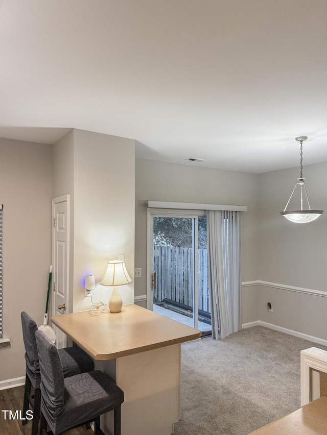 dining area with carpet