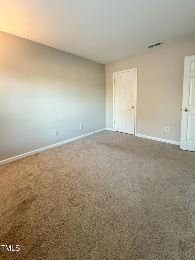 empty room featuring carpet floors