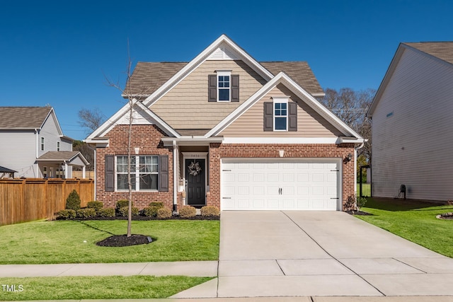 craftsman house featuring a garage and a front lawn