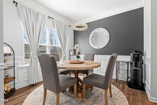 dining area featuring crown molding and dark hardwood / wood-style floors