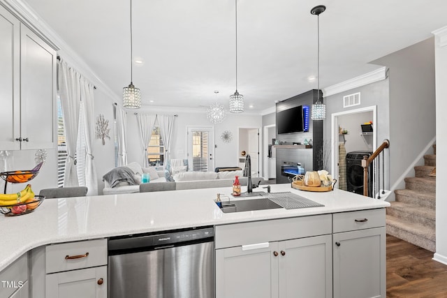 kitchen with ornamental molding, sink, stainless steel dishwasher, and decorative light fixtures