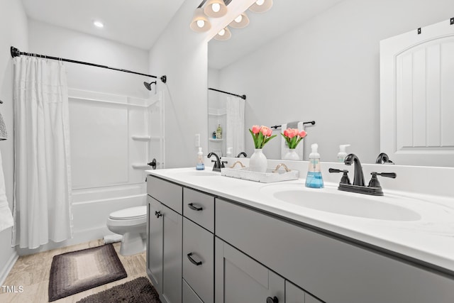 full bathroom with vanity, toilet, and shower / bath combo with shower curtain