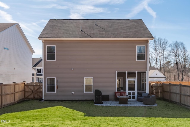 rear view of house featuring a patio and a lawn