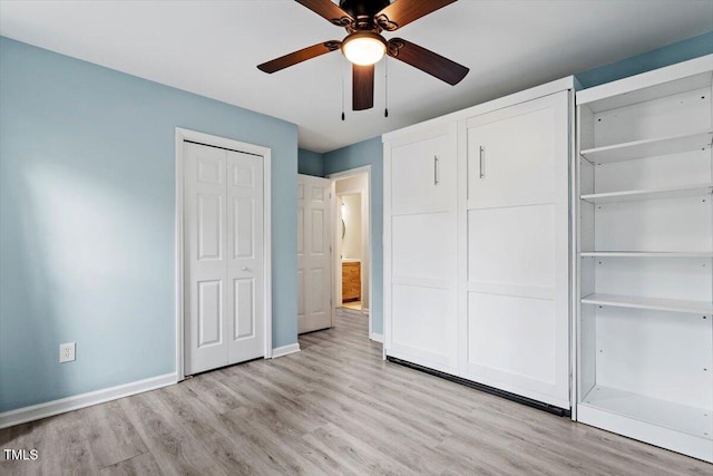 unfurnished bedroom featuring ceiling fan and light wood-type flooring