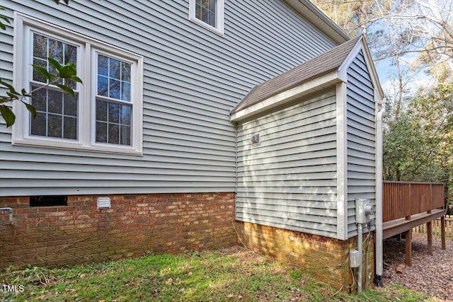 view of side of property with a deck