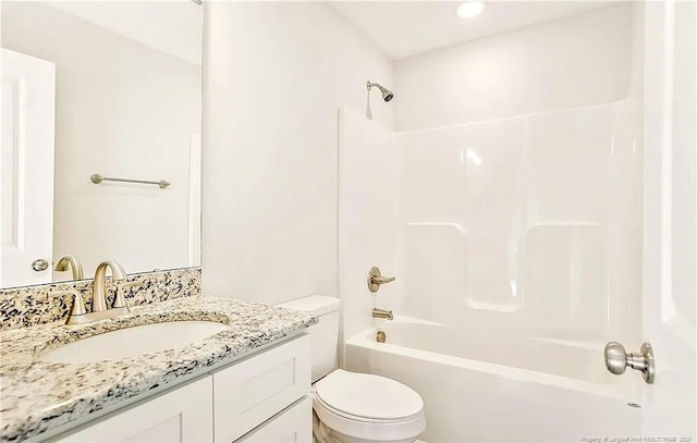 full bathroom with toilet, vanity, and  shower combination