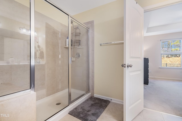 bathroom with tile patterned flooring and an enclosed shower