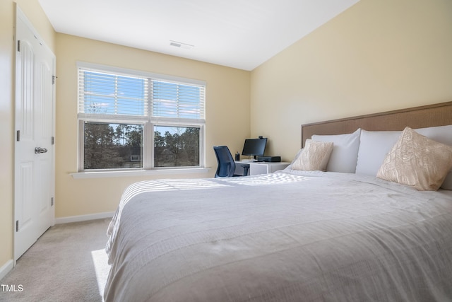 bedroom with light colored carpet