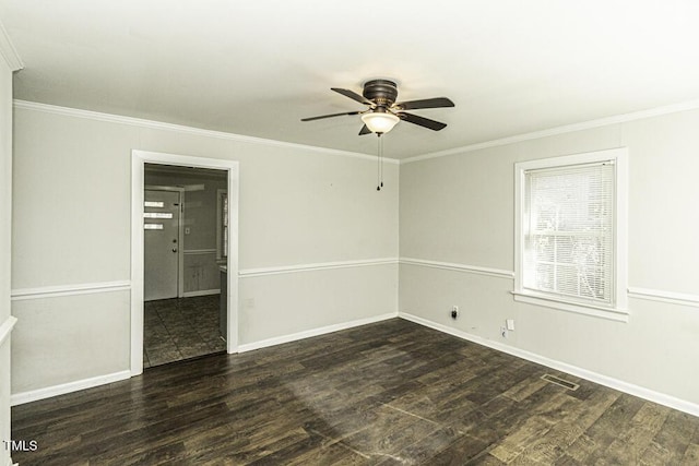 empty room with ceiling fan, dark hardwood / wood-style floors, and crown molding