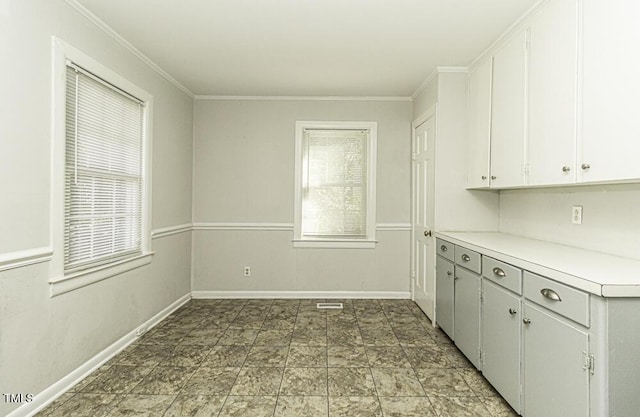 kitchen with white cabinets and crown molding