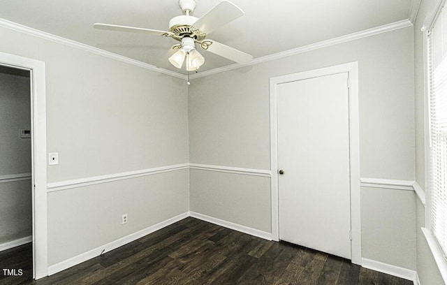 unfurnished room with crown molding, dark wood-type flooring, and ceiling fan