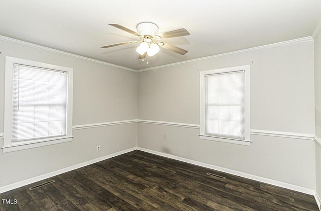 spare room with crown molding, dark wood-type flooring, and ceiling fan