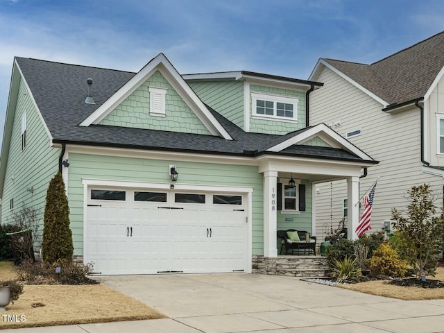 craftsman house with a garage and covered porch