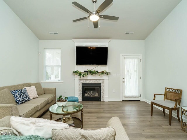 living room featuring hardwood / wood-style flooring and ceiling fan