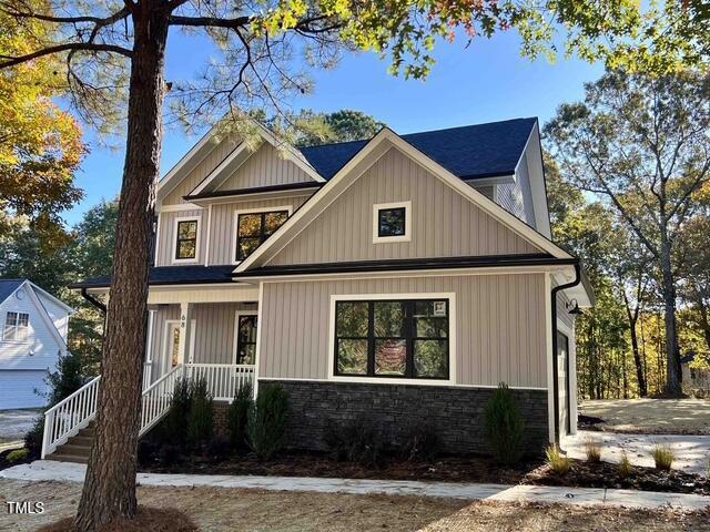 view of front of property featuring a garage and covered porch