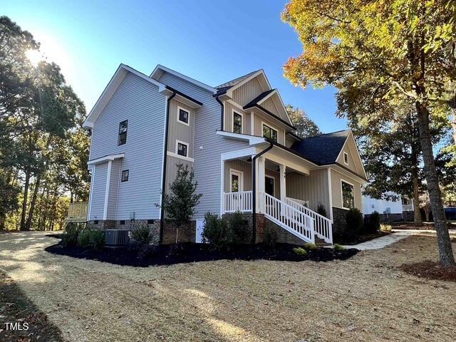 view of property exterior with a lawn