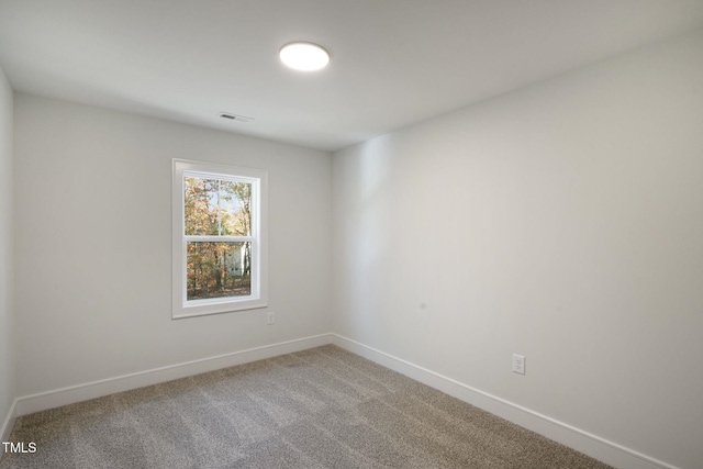 empty room with carpet flooring