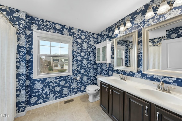 bathroom with vanity and toilet