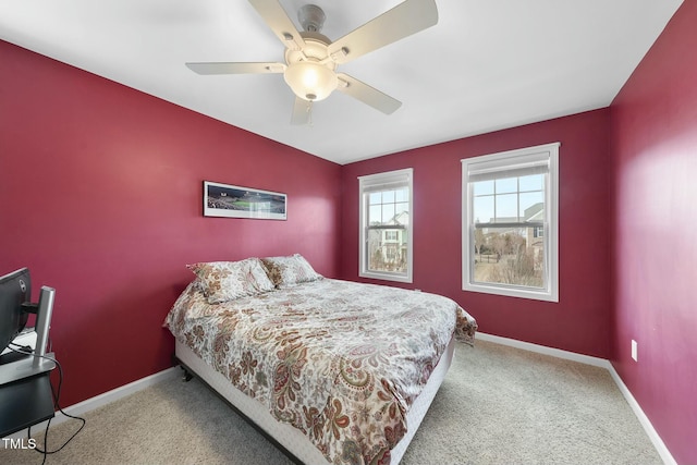 bedroom with light colored carpet and ceiling fan